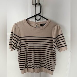 Short sleeve sweater with black stripes.